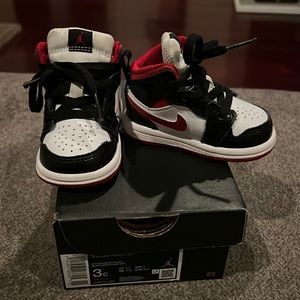 Jordan 1 mid. Black white and red.